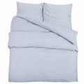 Housse de couette Lestona, coloris gris, sur un lit