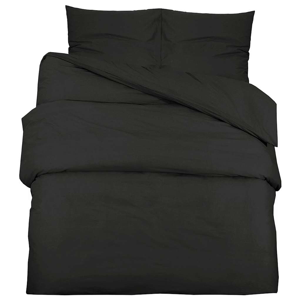 Housse de couette Lestona, coloris noir, sur un lit
